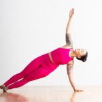 A person demonstrates Side Plank in yoga