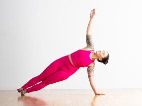 A person demonstrates Side Plank in yoga