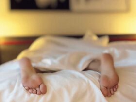 Image of person's feet in bed