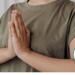 Hands together in prayer position.