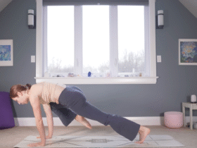 Woman in Plank Pose drawing one knee toward her nose during yoga for strength
