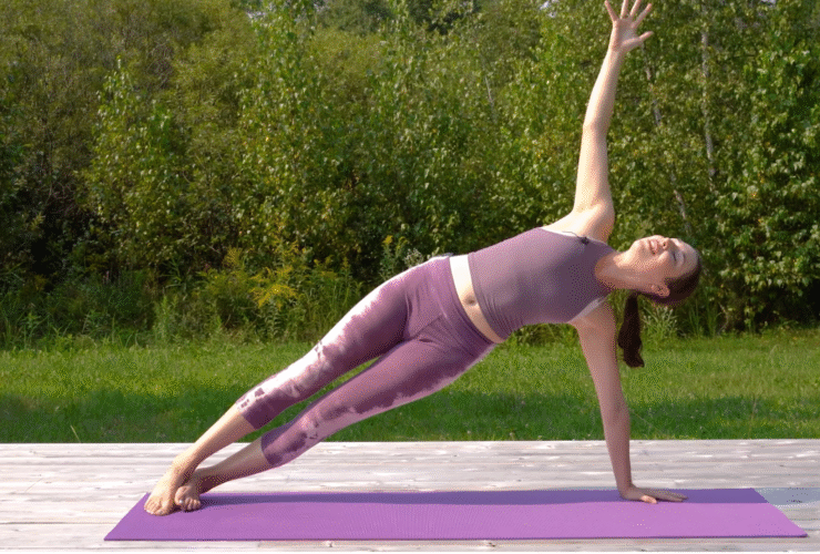 Woman in a yoga for core strength workout in Side Plank