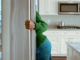 woman looking in the fridge for a snack
