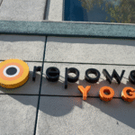 The CorePower Yoga logo on the side of a building