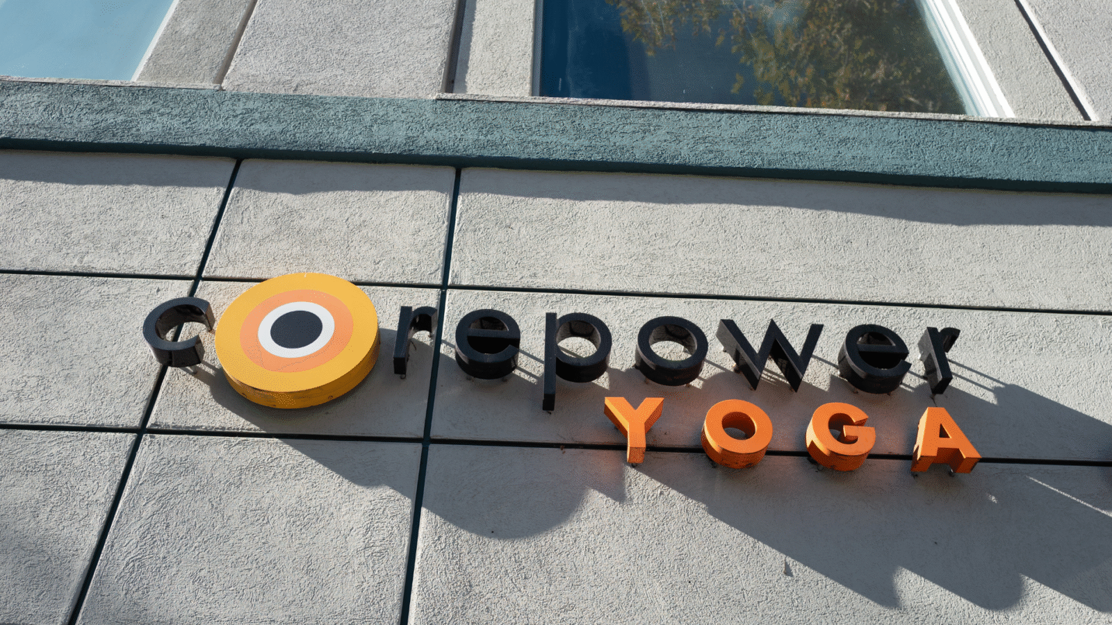 The CorePower Yoga logo on the side of a building