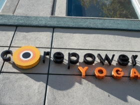 The CorePower Yoga logo on the side of a building