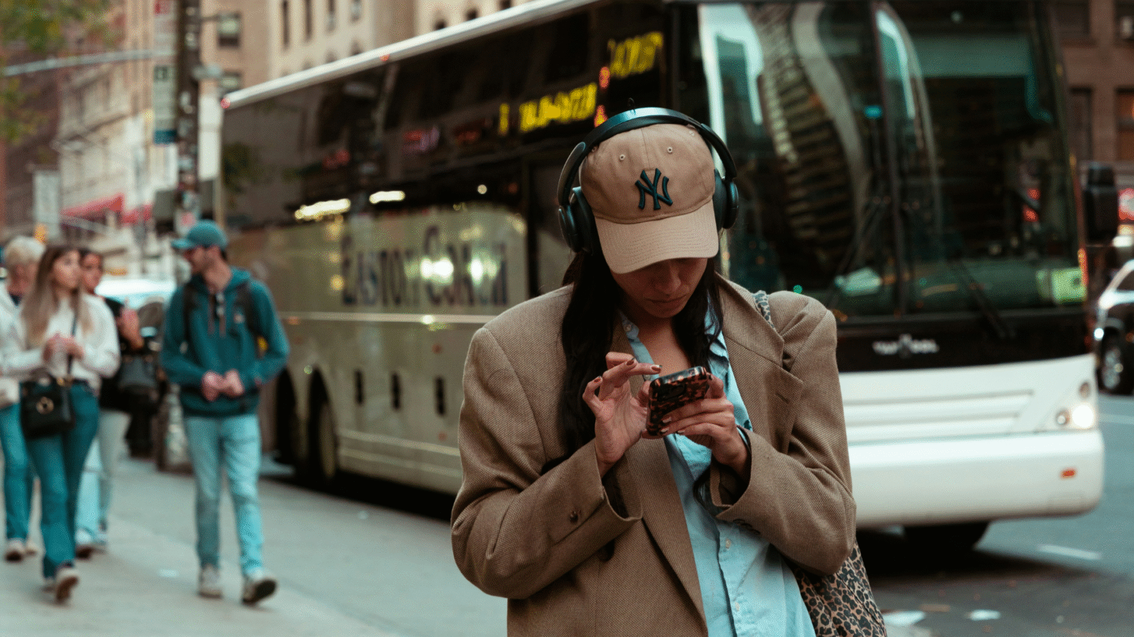 A woman in headphones using Yoga Journal's text to speech option