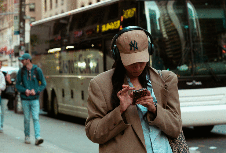A woman in headphones using Yoga Journal's text to speech option