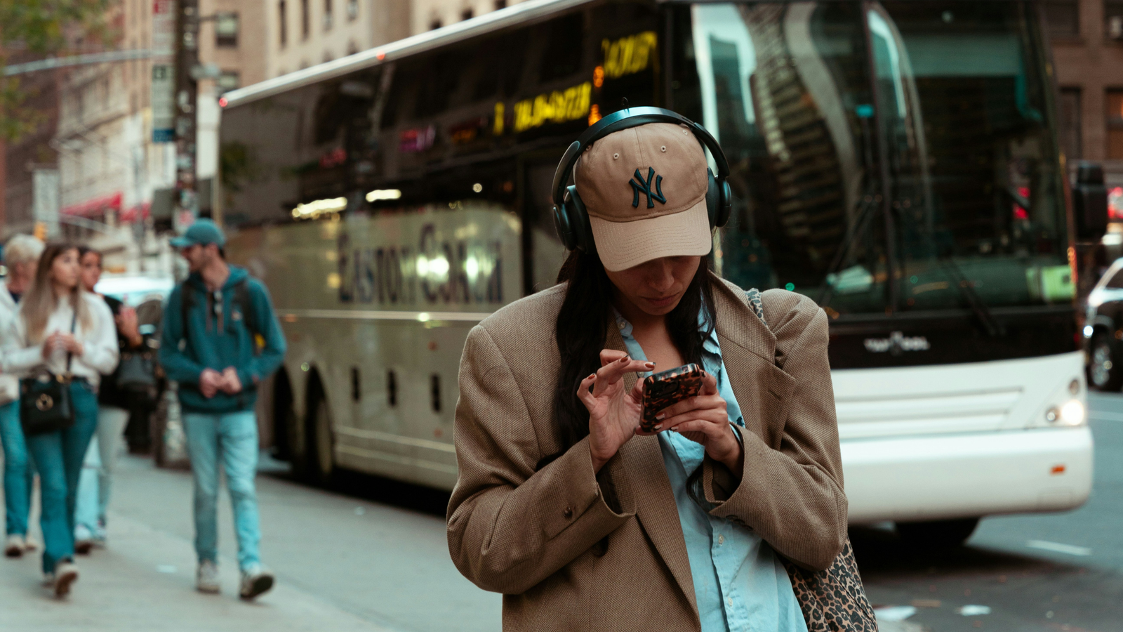 A woman in headphones using Yoga Journal's text to speech option