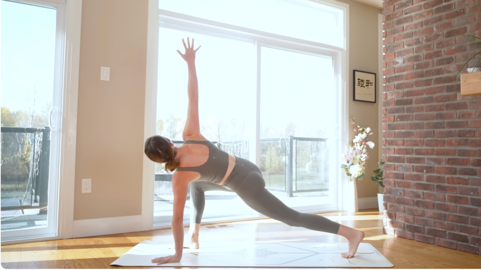 Yoga teacher leading a power yoga for energy flow with a twisting low lunge
