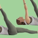 Image of woman practicing reclining big toe pose set against lime green background.