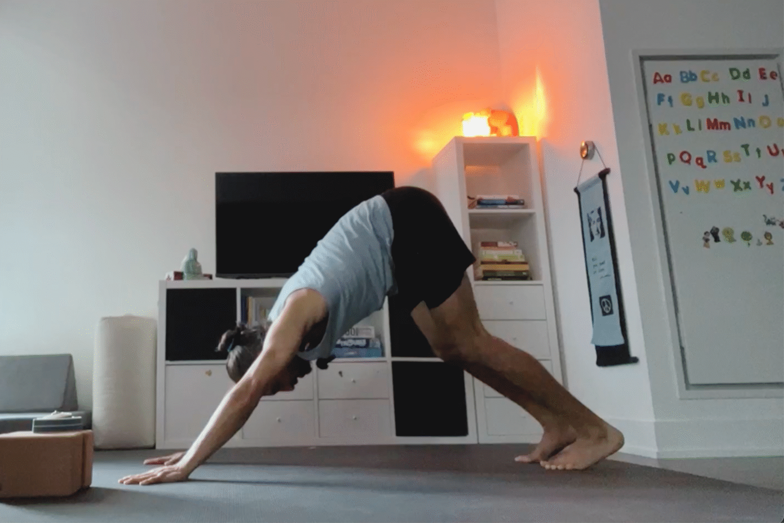 oga teacher Jaffer Hussain in Downward-Facing Dog, part of his simple yoga flow