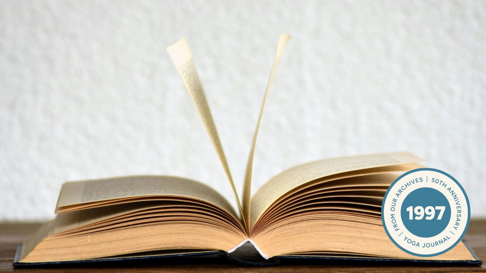 Image of opened book on table.