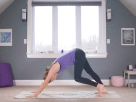 Woman in Downward-Facing Dog with one knee bent and the other straight