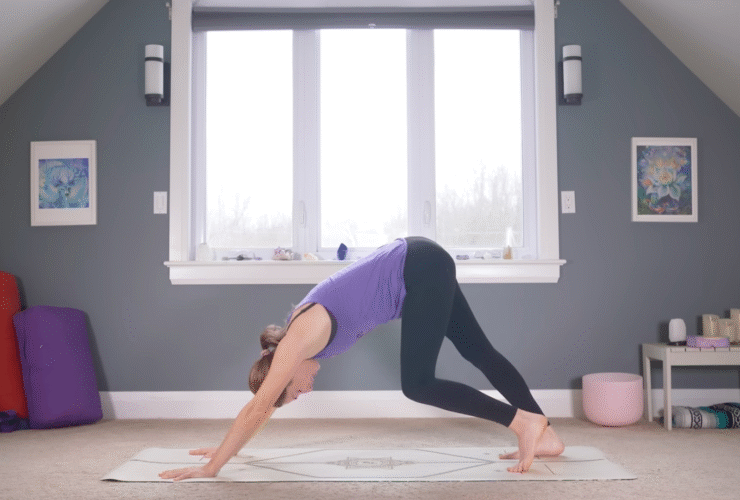 Woman in Downward-Facing Dog with one knee bent and the other straight