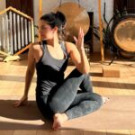 Yoga instructor practicing Seated Twist.