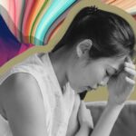 Colorful image of a woman holding her head in her hands