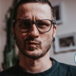 Close-up of man's face looking confused.