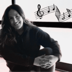 Yoga teacher Anaiz Ochoa sitting on the wood floor at Sweatshop Central yoga studio in Phoenix, where she teaches yoga with Bad Bunny playlists