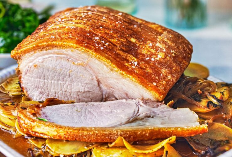 Pork loin roast with caramelised onion & garlic potatoes recipe