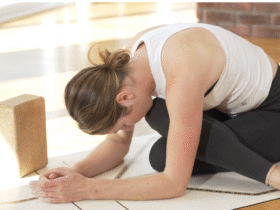 Woman practicing a forward bend that's a hip opener