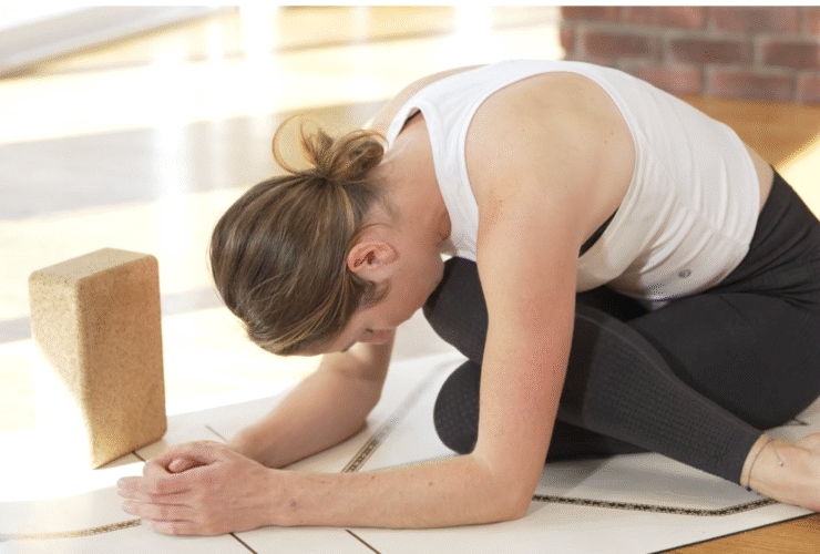 Woman practicing a forward bend that's a hip opener