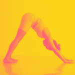 A woman in Downward-Facing Dog