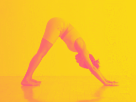 A woman in Downward-Facing Dog