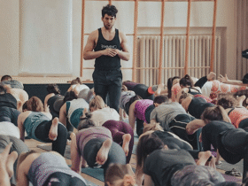 London-based yoga teacher Adam Husler teaches a class while walking and watching rather than demonstrating poses.