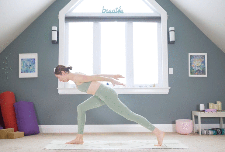 Woman in High Lunge leaning her chest forward and reaching her arms behind her