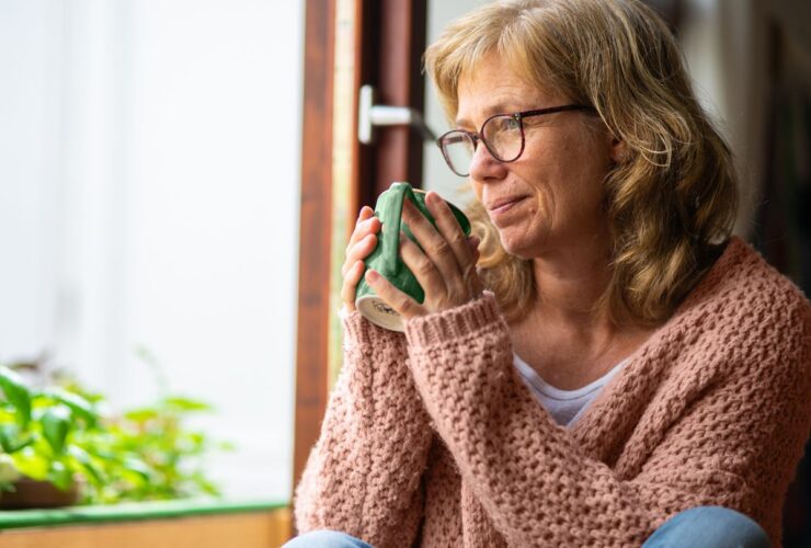 mature woman drinking herbal tea for menopause symptoms