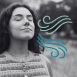 A woman breathing in and out