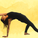 Woman practicing Wild Thing against a yellow watercolor backdrop