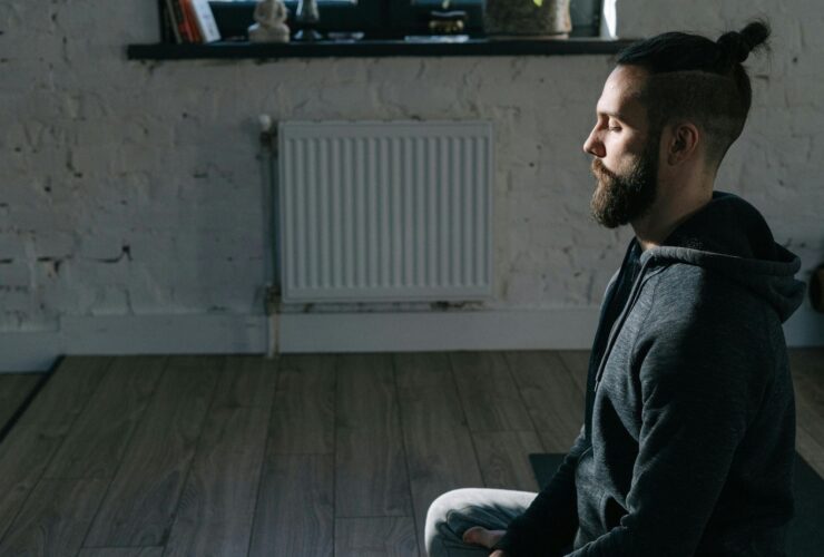 Image of man meditating in Easy Pose.