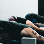 Yoga in Spanish class with students in Child's Pose