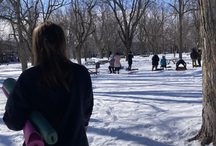 Woman standing in front of a snowga class in a park in Montreal