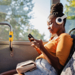 A woman using her phone on a bus