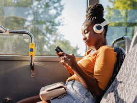 A woman using her phone on a bus