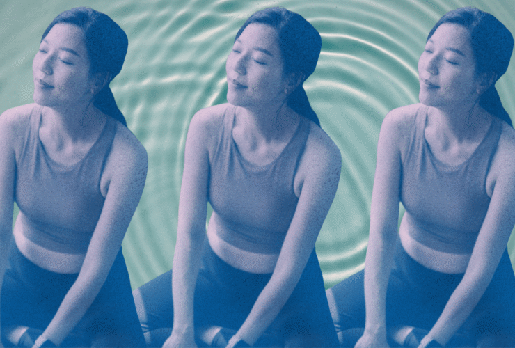 A woman sitting calmly against a water backdrop