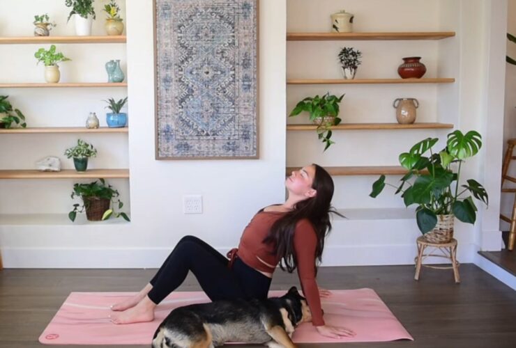 Caitlin K'eli practicing seated chest stretch.