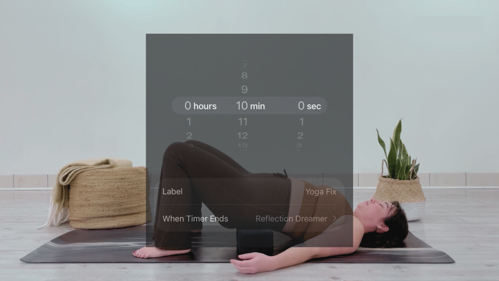 Taylor Lorenz practicing with an overlay of a timer representing 10 minute yoga
