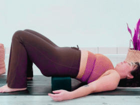 Yoga teacher Taylor Lorenz in Supported Reclined Butterfly Pose, part of her yin yoga for energy practice