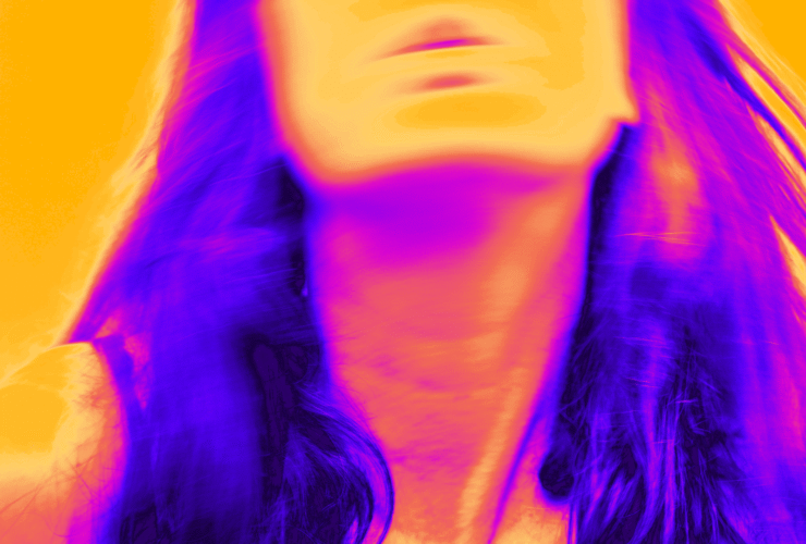 Infrared filter of a photo featuring a woman tilting her head back during hot flashes.