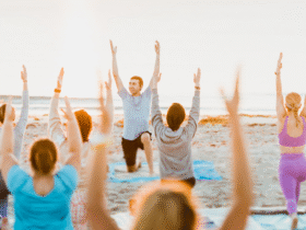 Yoga class led by Pedro Luna on a beach in Florida as he's learning how to become a yoga teacher who leads students authentically