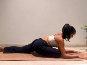 Yoga instructor doing pigeon pose.