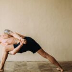 Man practicing Ashtanga yoga.