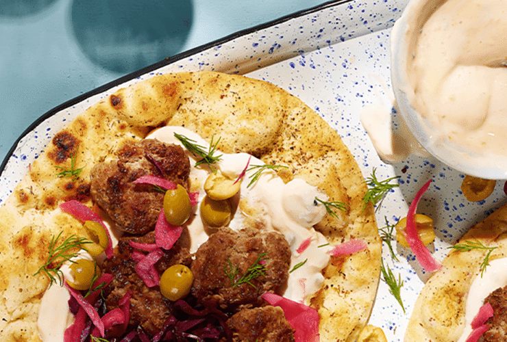Lamb koftas with mango yoghurt sauce, flatbreads & pickles