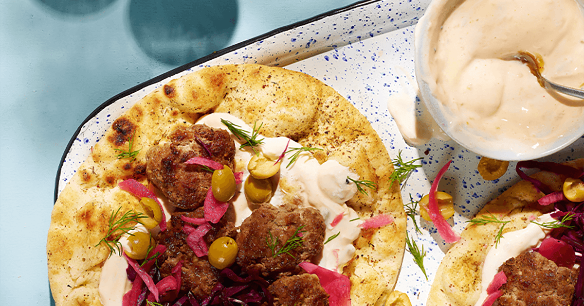 Lamb koftas with mango yoghurt sauce, flatbreads & pickles