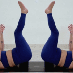 Yoga teacher Taylor Lorenz in Supported Waterfall, part of her yoga practice for when you're feeling overstimulated