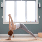 Woman leaning forward in Humble Warrior with her hands clasped behind her back